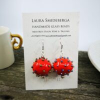 Bright red hollow glass lampwork bead earrings with metallic color bumps.