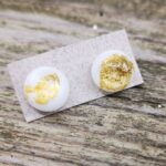 White glass and gold stud earrings