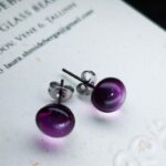 Magenta color stud earrings