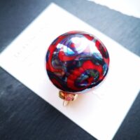 Transparent orange and silver glass Christmas ornament
