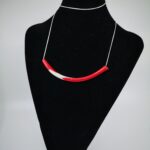 Tunnel bead pendant in colours of the Latvian flag on a long chain