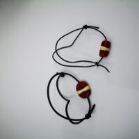 Friendship bracelets in the colours of the Latvian flag